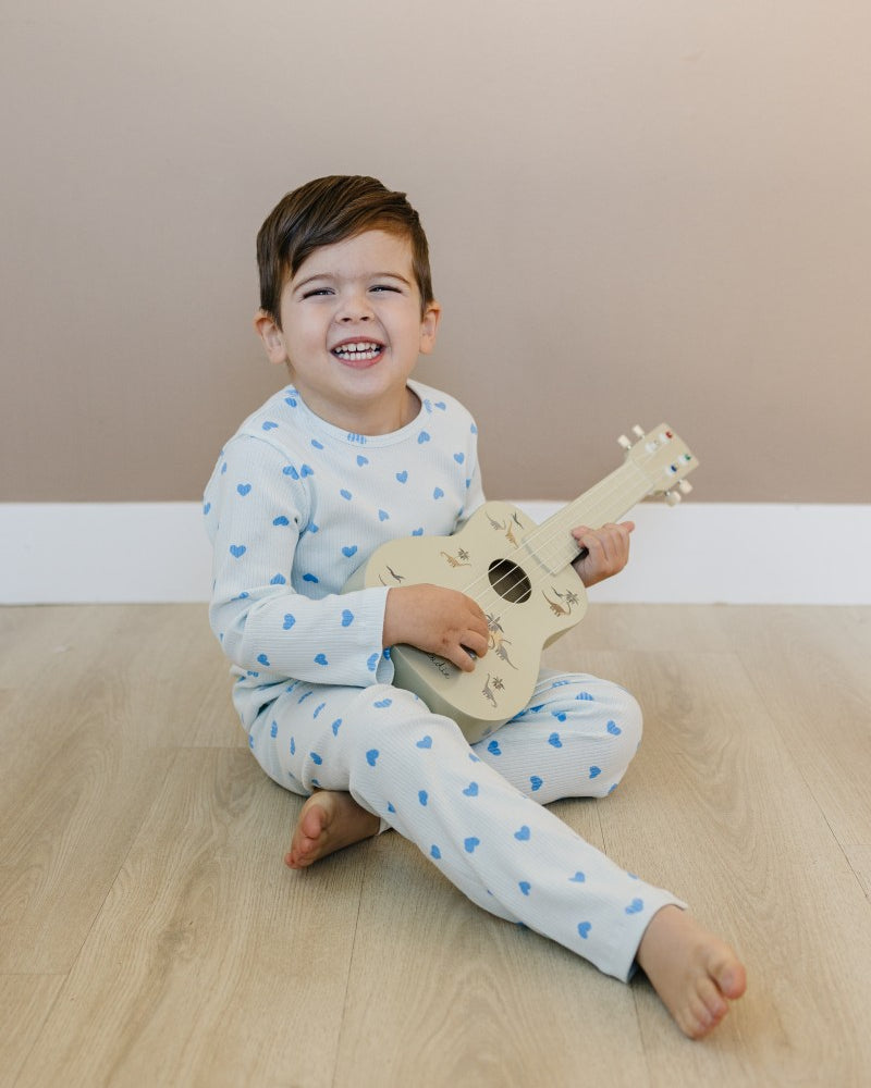 Toddler in blush pink heart print comfort wear showing stretchy movement and fit