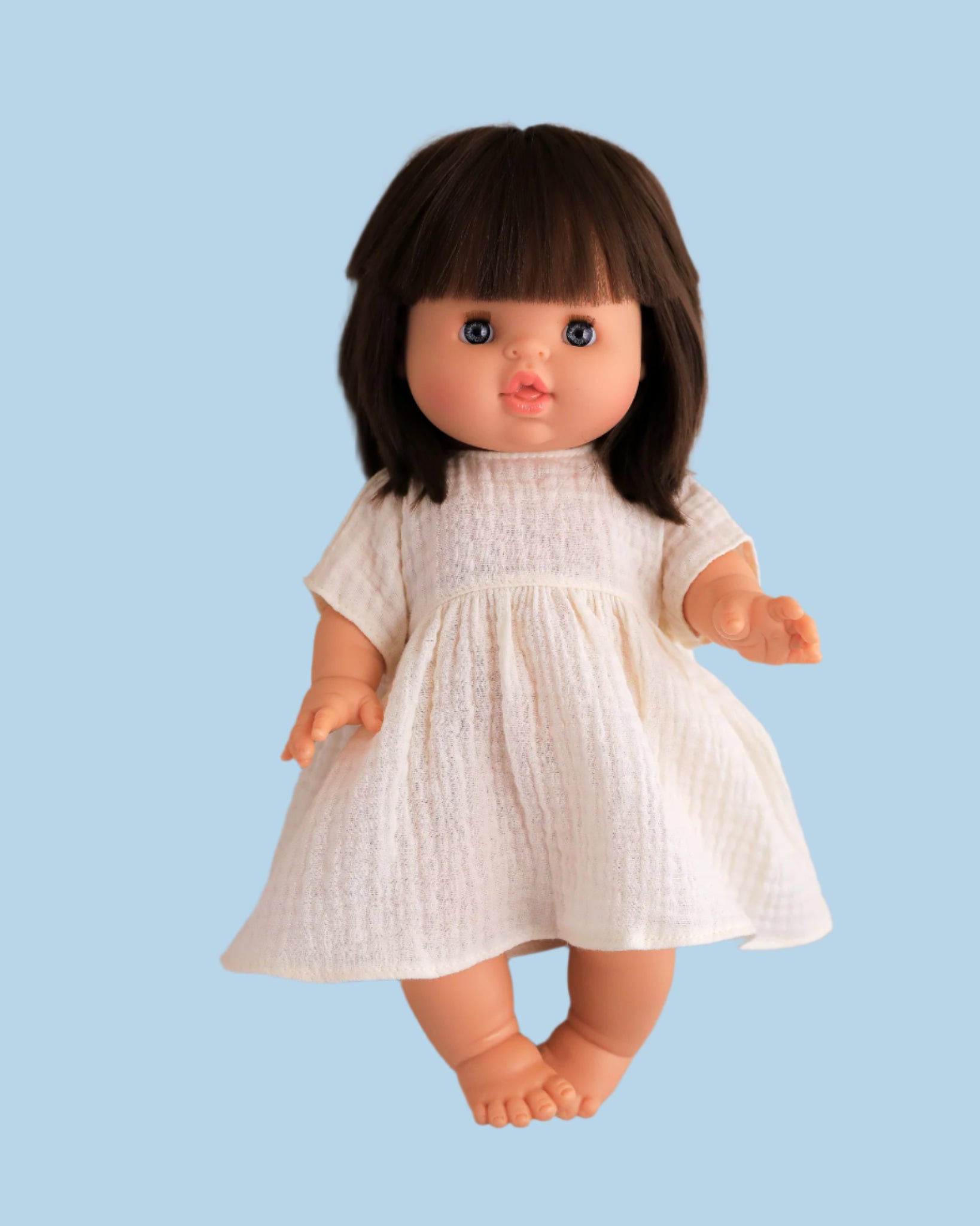 Smocked baby doll dress with delicate stitching