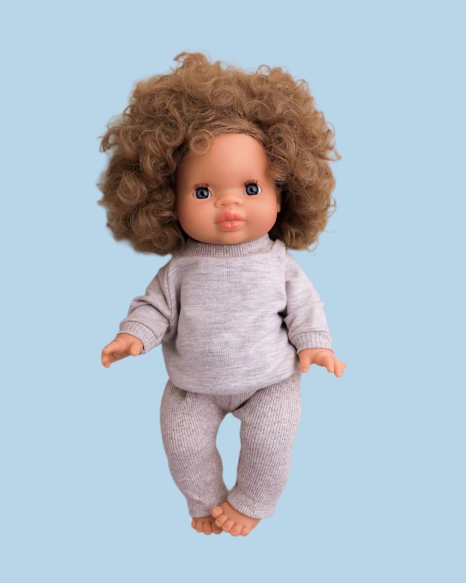 Doll sweater with intricate knitting pattern