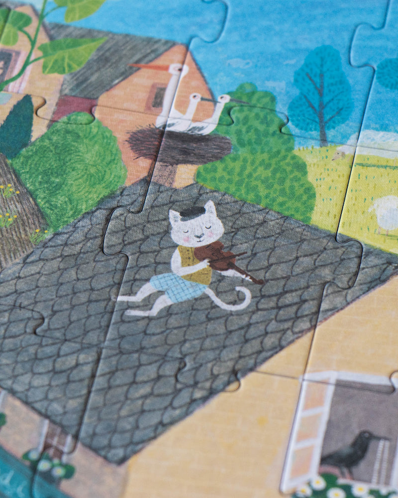 Children's puzzle with a cat on a roof and houses in the background