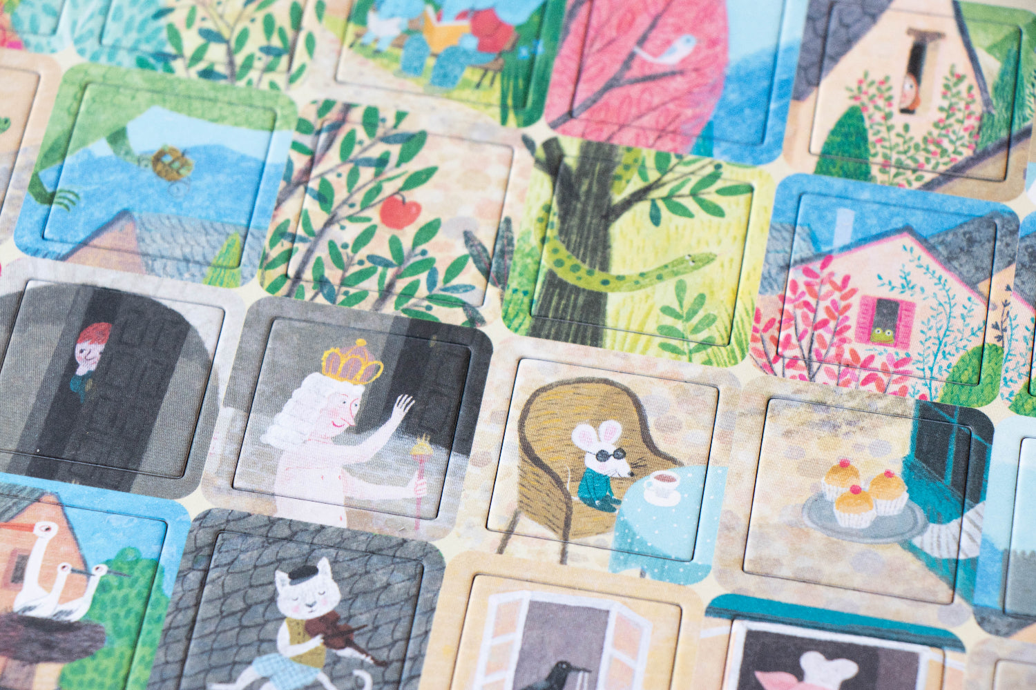 Collection of colorful illustrated cards with various scenes and characters.