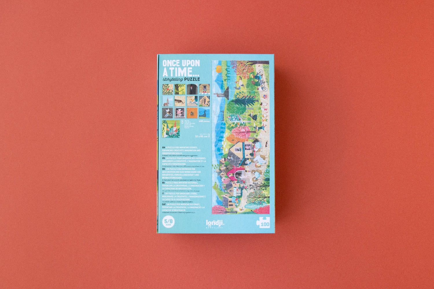Jigsaw puzzle box with colorful images on a red background