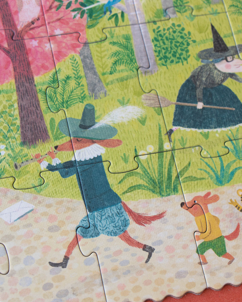 Children's puzzle with a witch and animal characters in a forest setting