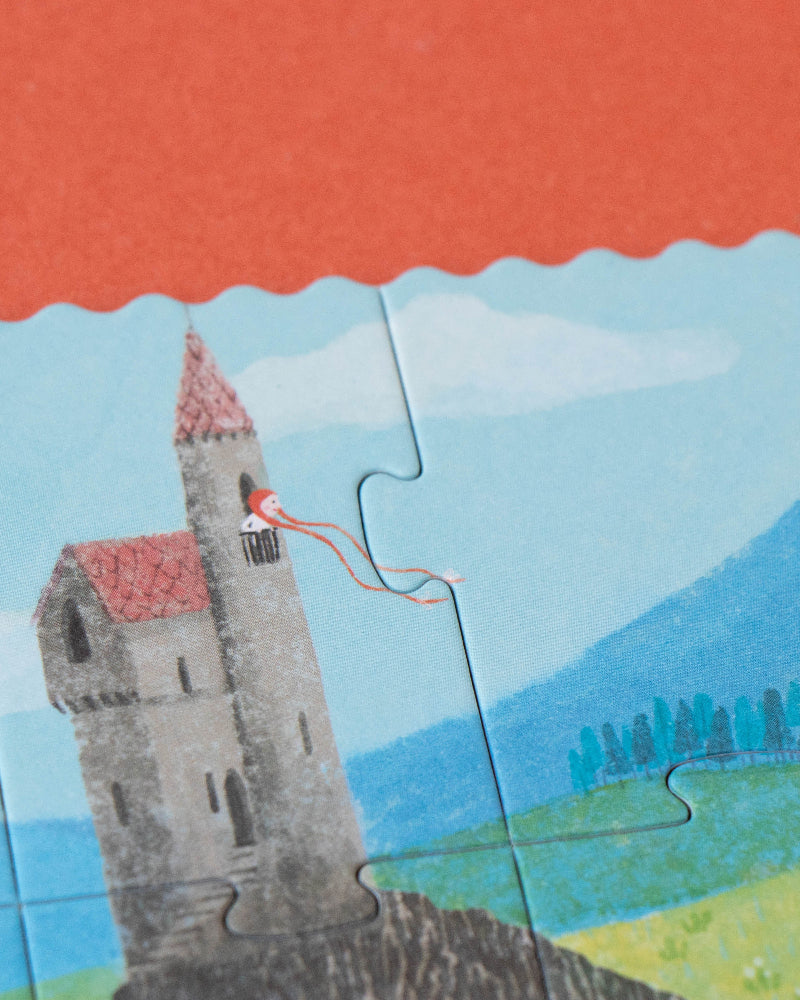 Jigsaw puzzle with a castle design on a red surface
