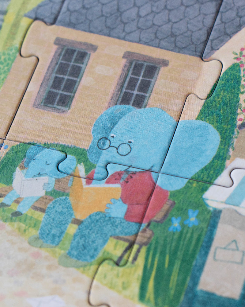 Children's puzzle with a cartoon elephant and bear in a garden setting
