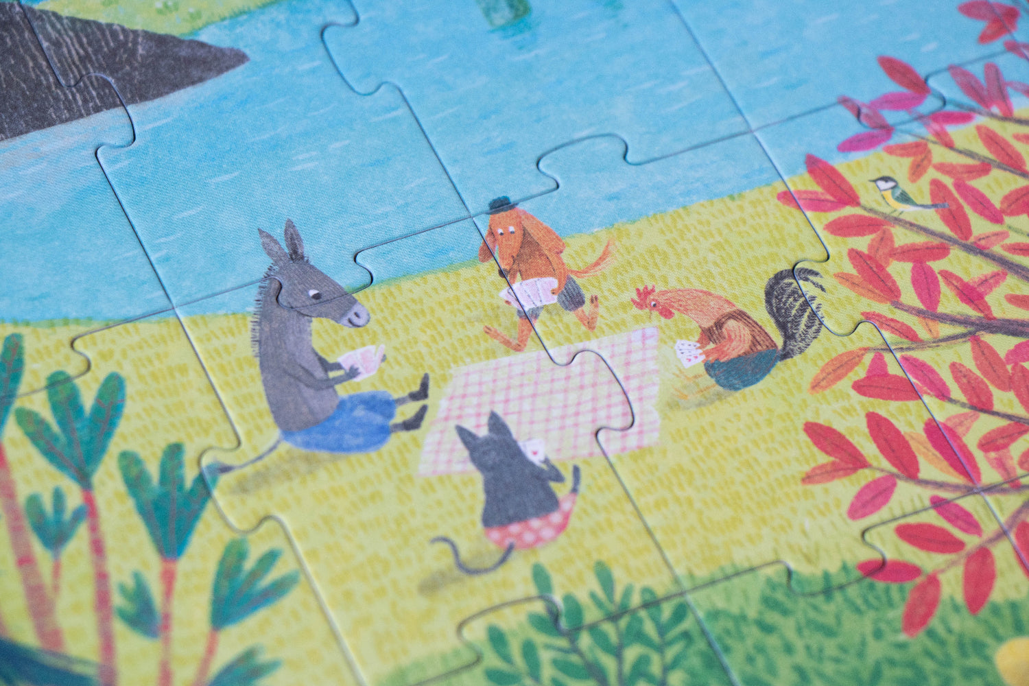Children's puzzle with cartoon animals in a park setting