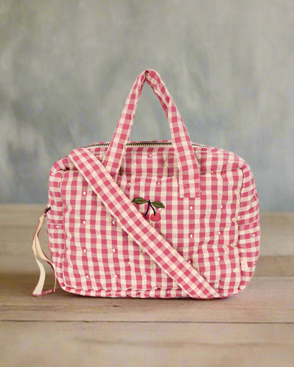Pink gingham baby doll diaper bag with dual handles and shoulder strap in bubblegum check pattern