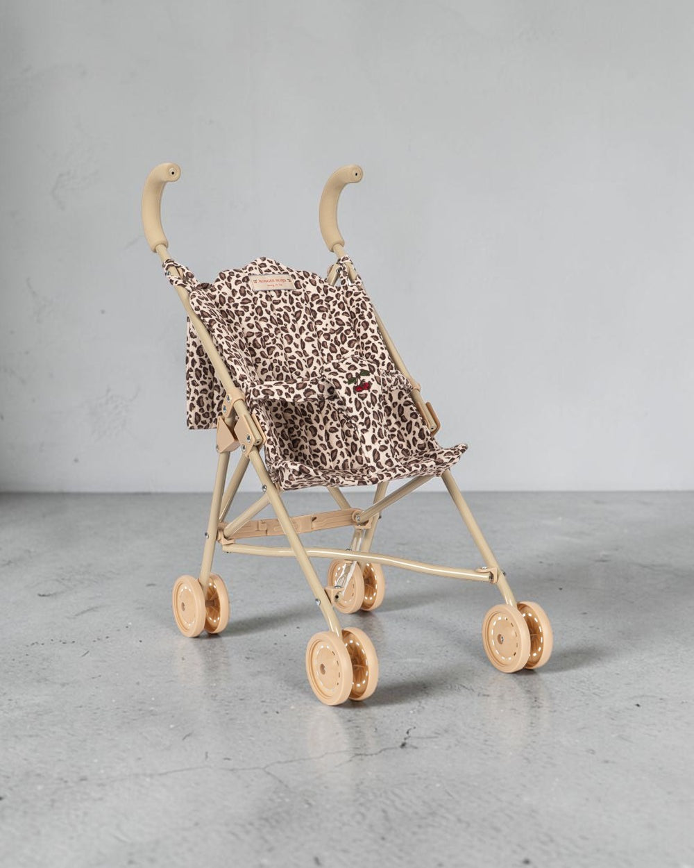 Playroom Collective Konges Sloejd leopard print doll stroller with sage frame and double wheels
