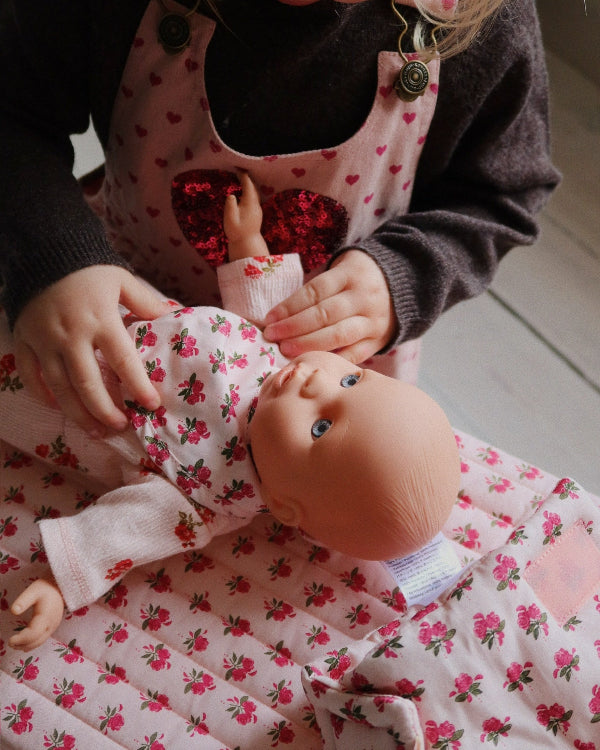 Rosie Rose nursery set styled with matching collection pieces in vintage-inspired doll care setting