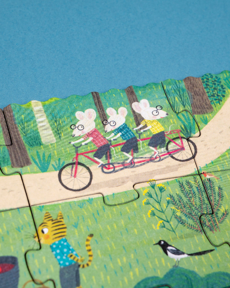 Children's puzzle with cartoon characters riding a tandem bicycle on a blue sky background