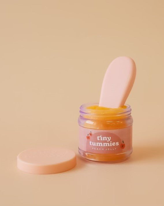 Detailed play kitchen accessories including Tiny Harlow peach jellydoll food jar set