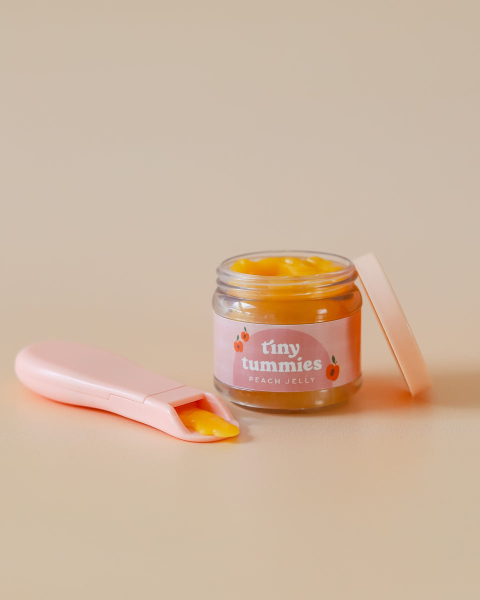 http://playroomcollective.com/cdn/shop/files/tiny-harlow-food-jar-peach-3_1200x1200.jpg?v=1686015452