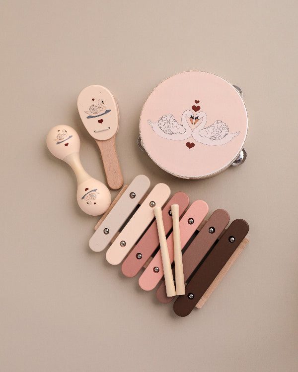 Five-piece wooden swan music set with tambourine, castanet, maraca, xylophone and storage box in pink