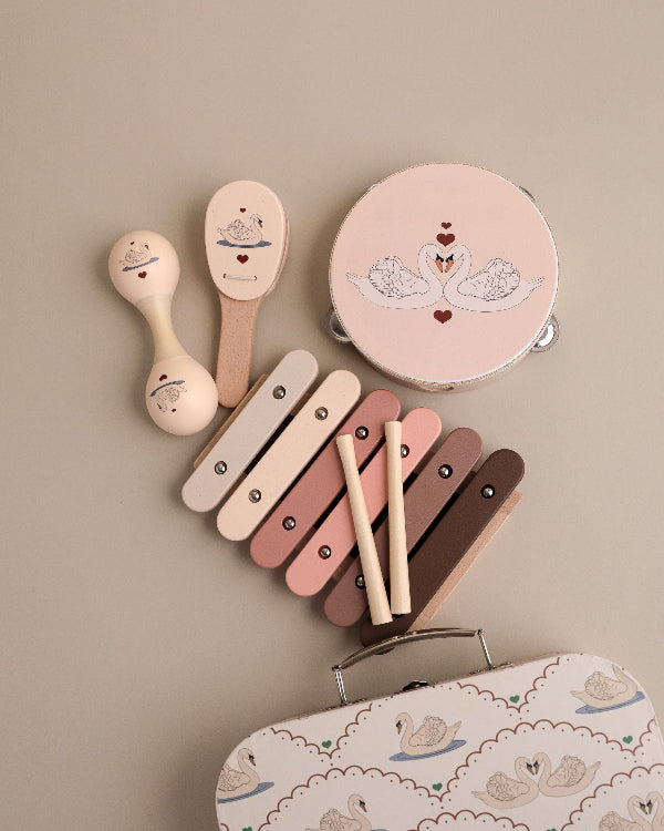 FSC-certified swan-themed musical instruments with romantic heart details and elegant design