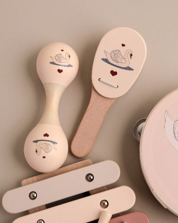 Sustainable wooden music set featuring elegant swan theme and comprehensive instrument variety for kids