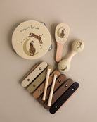 Five-piece wooden tiger music set with tambourine, castanet, maraca, xylophone and storage box