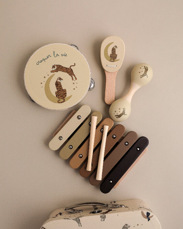 FSC-certified tiger-themed musical instruments showing croquer la vie French design details