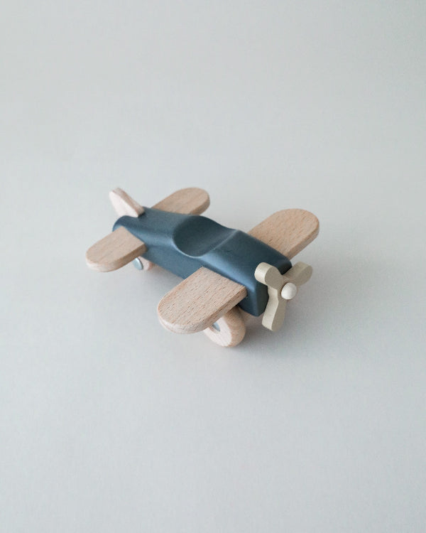 Blue wooden toy airplane made from premium beechwood with moving wheels and spinning propeller