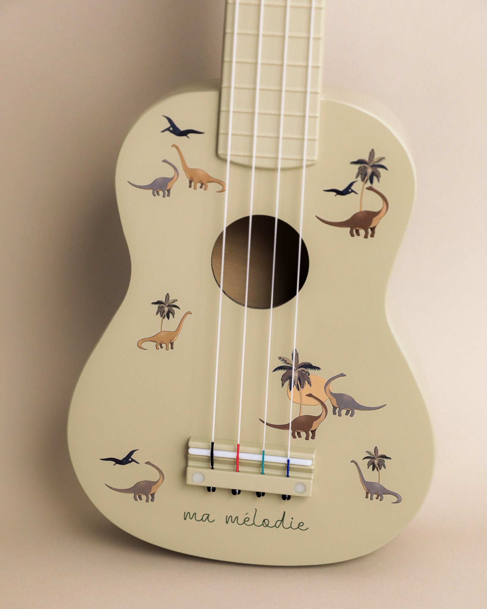 Adventure-themed wooden ukulele with 4 nylon strings and tunable pegs perfect for little explorers