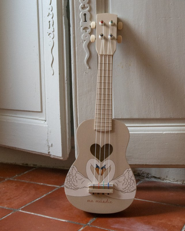 Swan print wooden ukulele with elegant wing design and heart sound hole on cream finish