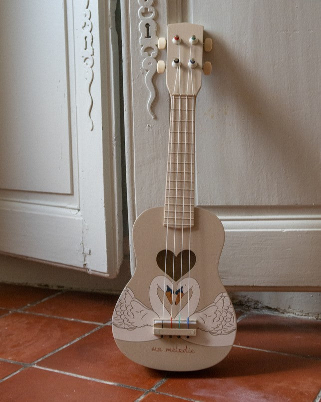 Swan print wooden ukulele with elegant wing design and heart sound hole on cream finish