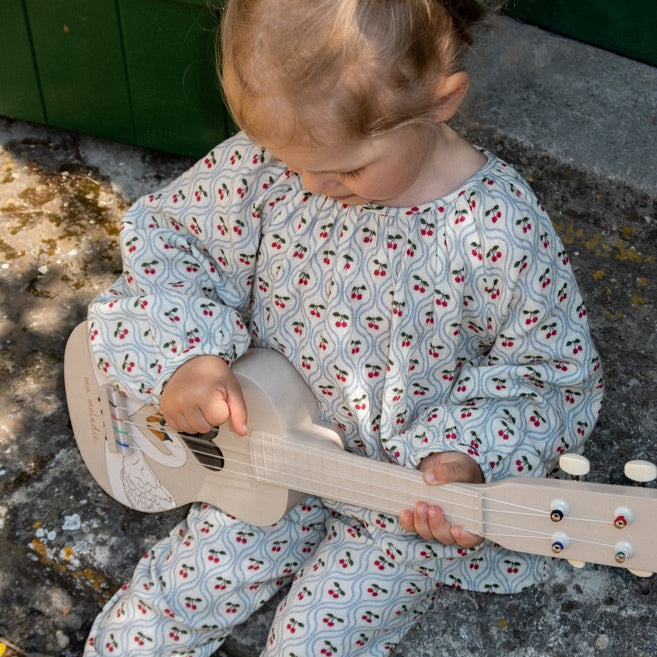 FSC-certified kids ukulele featuring detailed hand-painted swan artwork and ma melodie script