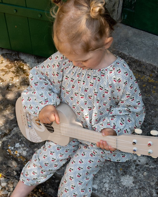 FSC-certified kids ukulele featuring detailed hand-painted swan artwork and ma melodie script