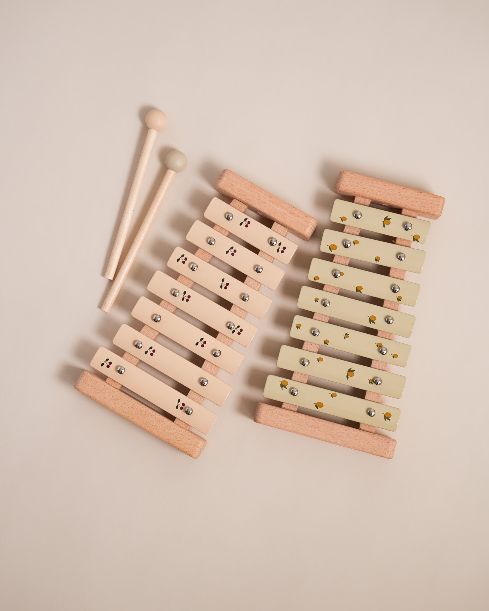Montessori wooden xylophone with 7 tuned aluminum bars arranged in correct musical sequence