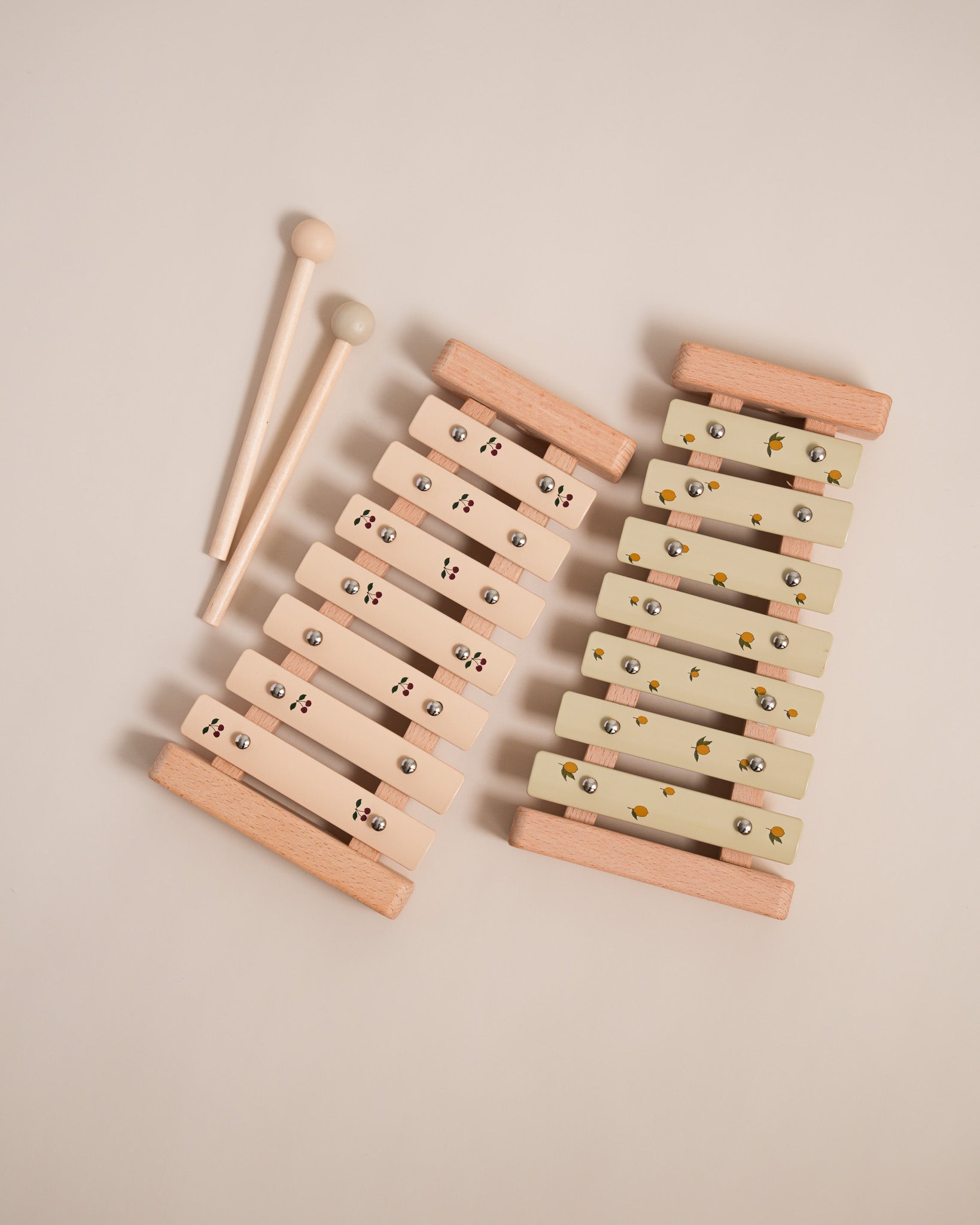 Montessori wooden xylophone with 7 tuned aluminum bars arranged in correct musical sequence