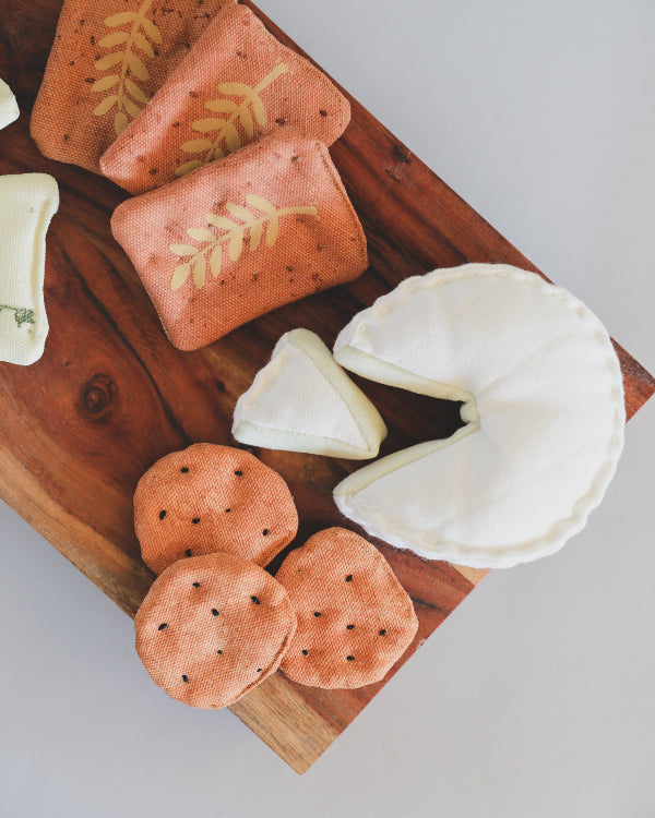 Gourmet play food charcuterie collection featuring hand-embroidered herb cheese and silk screen printed crackers