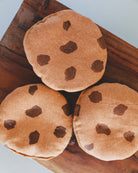 Realistic soft play food cookies showing detailed hand-embroidered chocolate chip designs and premium textile construction