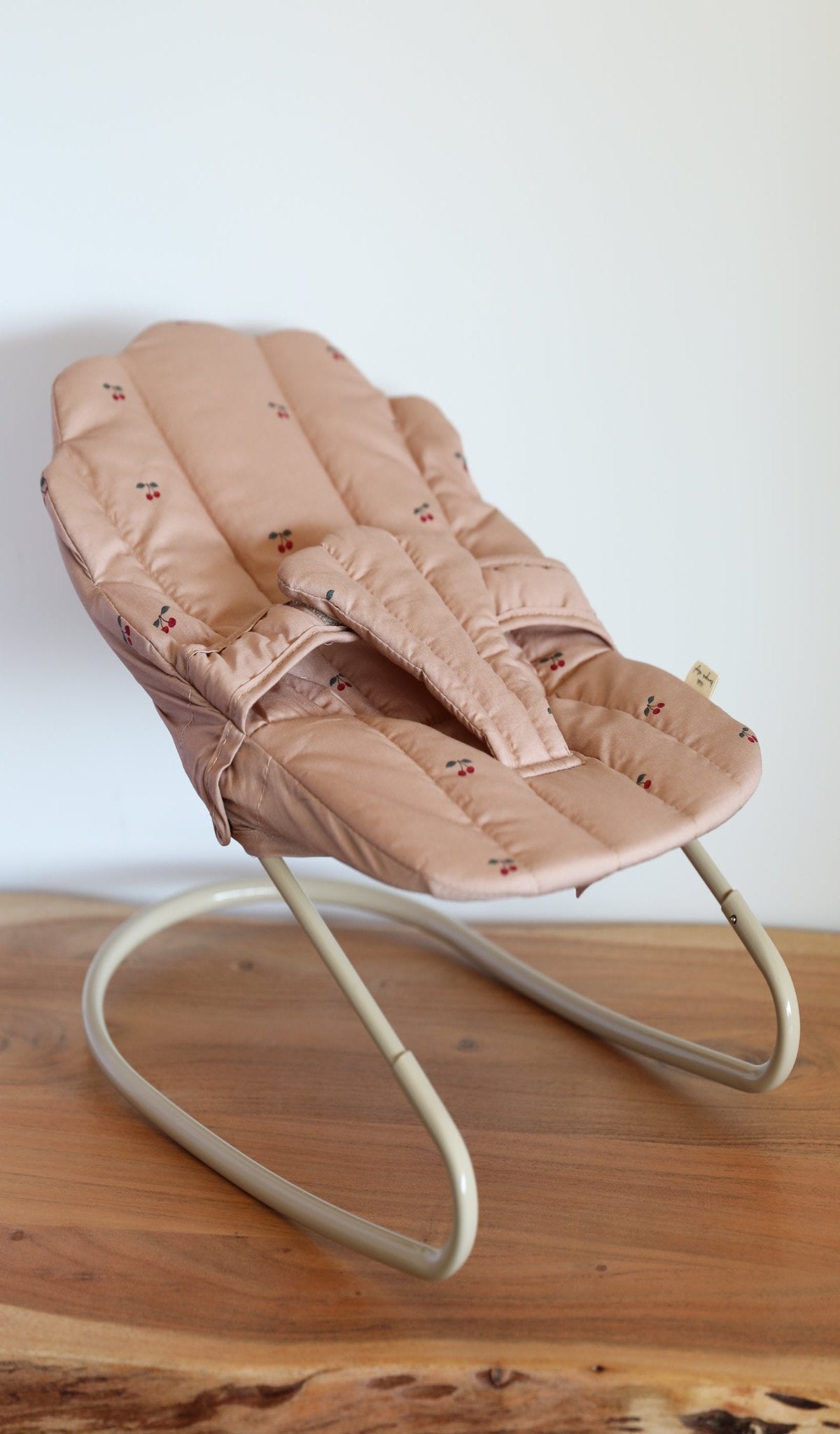 Vibrant baby doll bouncer with adjustable straps for imaginative playroom adventures