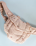 Hands-free doll carrier encouraging developmental pretend play skills