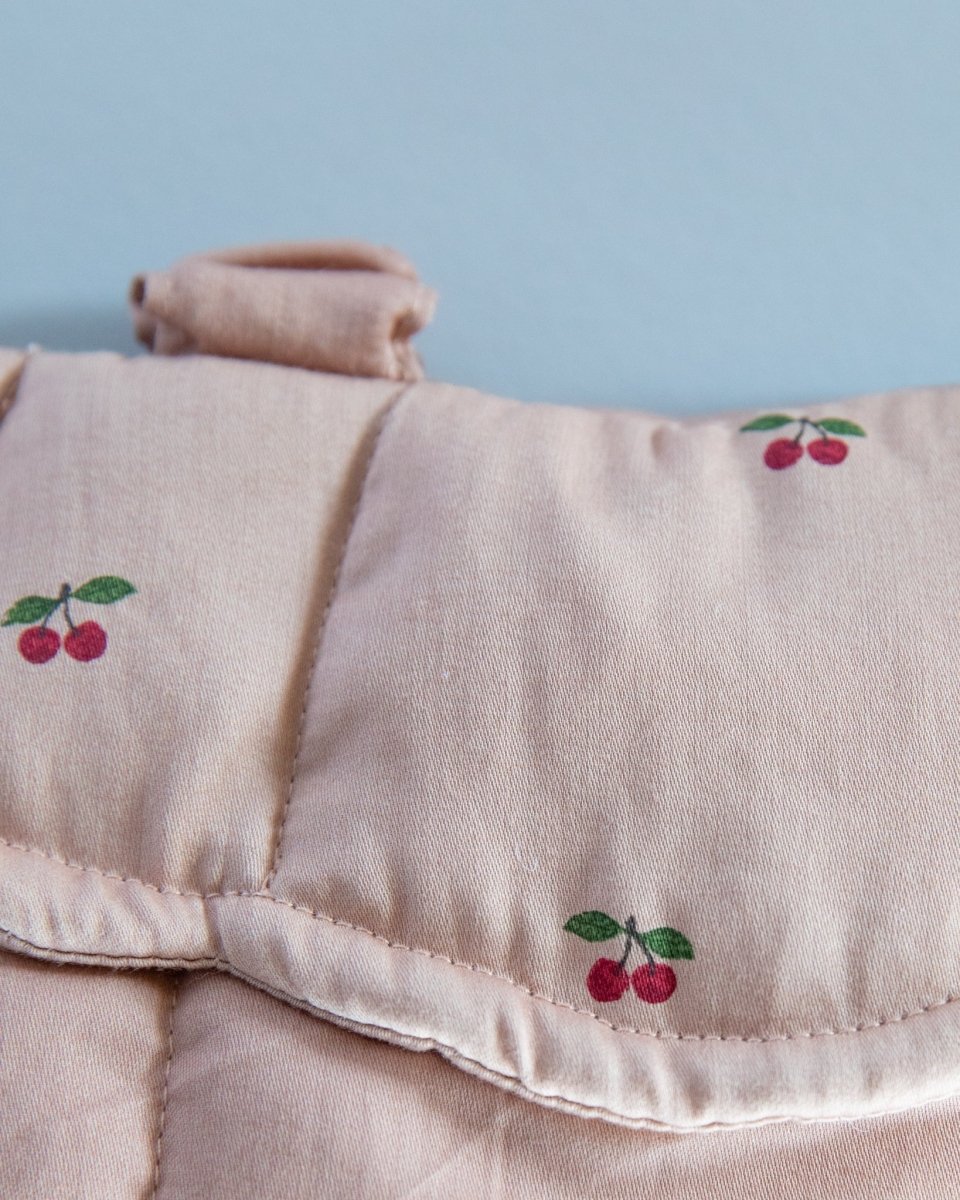 Playroom favorite: adjustable doll carrier with secure fastening