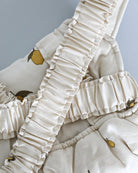 Patterned doll accessories with front carrying options