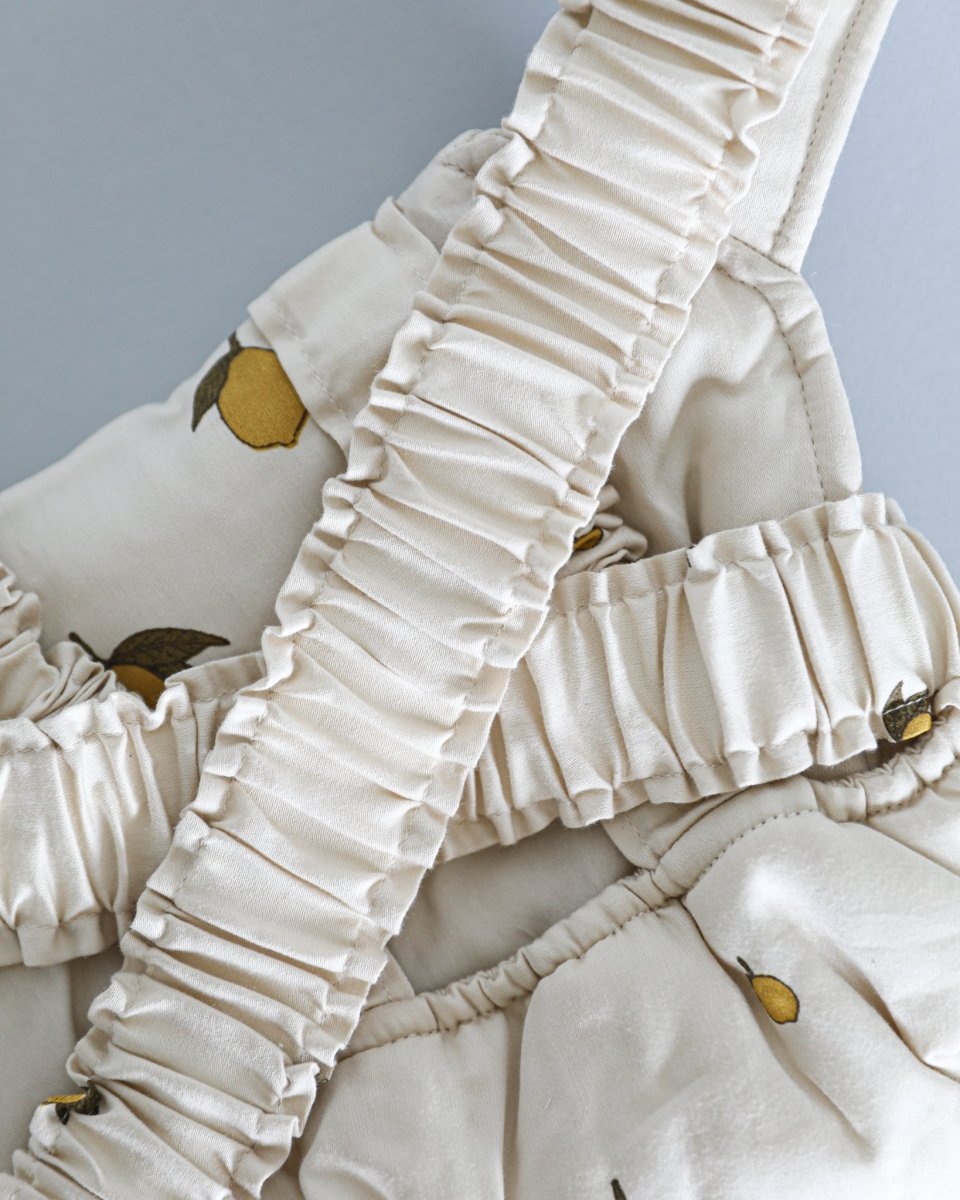 Patterned doll accessories with front carrying options