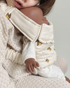 Playroom-approved doll carrier with easy-to-use straps for small hands