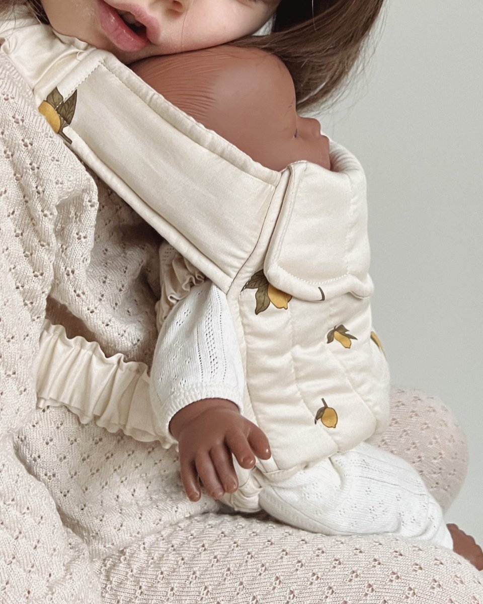 Playroom-approved doll carrier with easy-to-use straps for small hands
