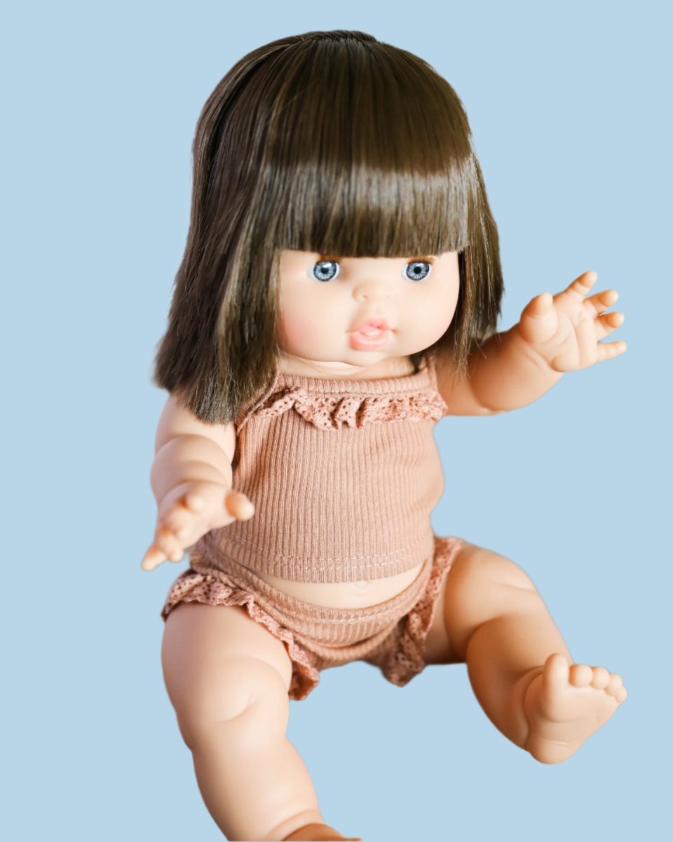Doll clothing with intricate cutwork details