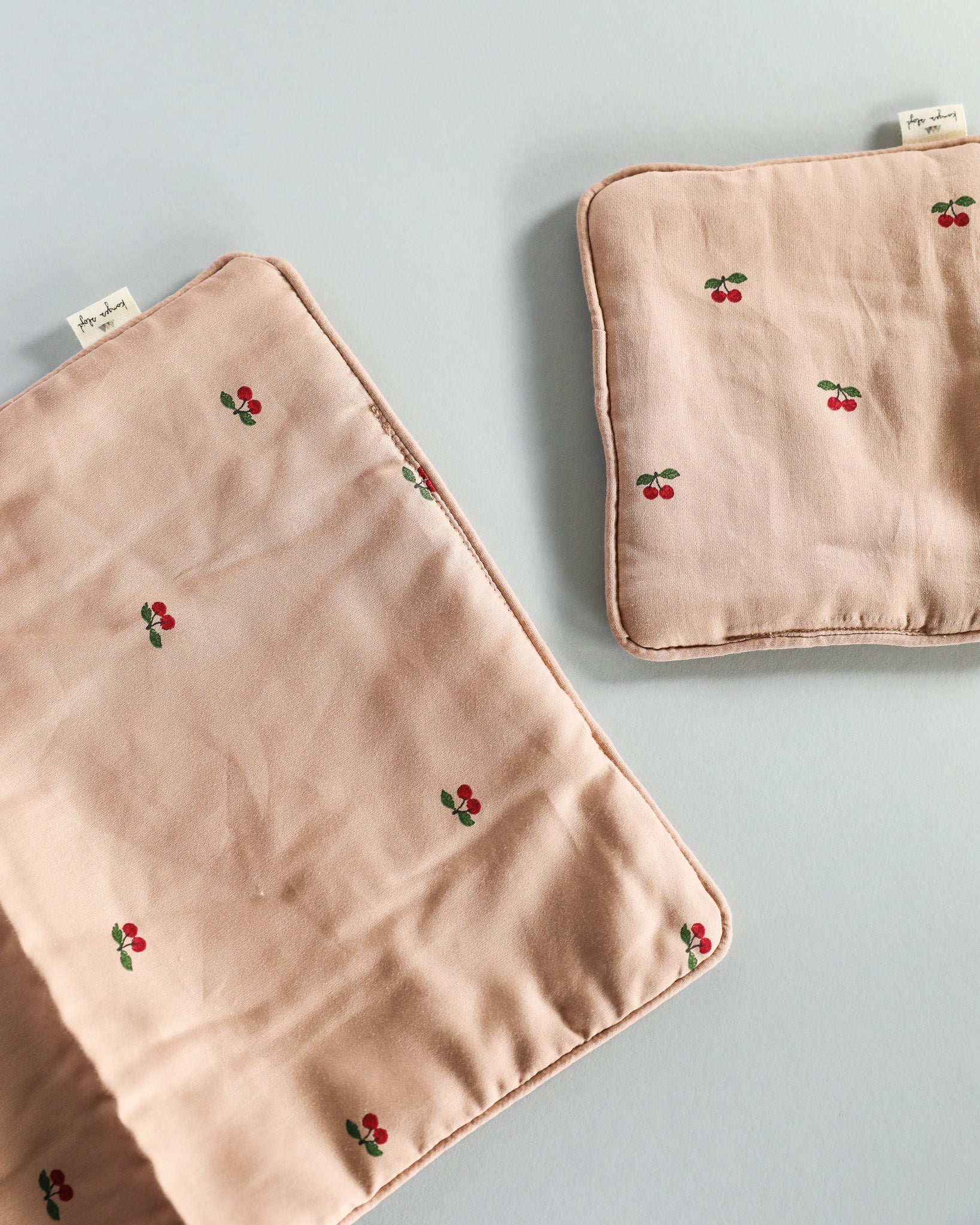 Doll pillow and matching blanket set encouraging nurturing pretend play