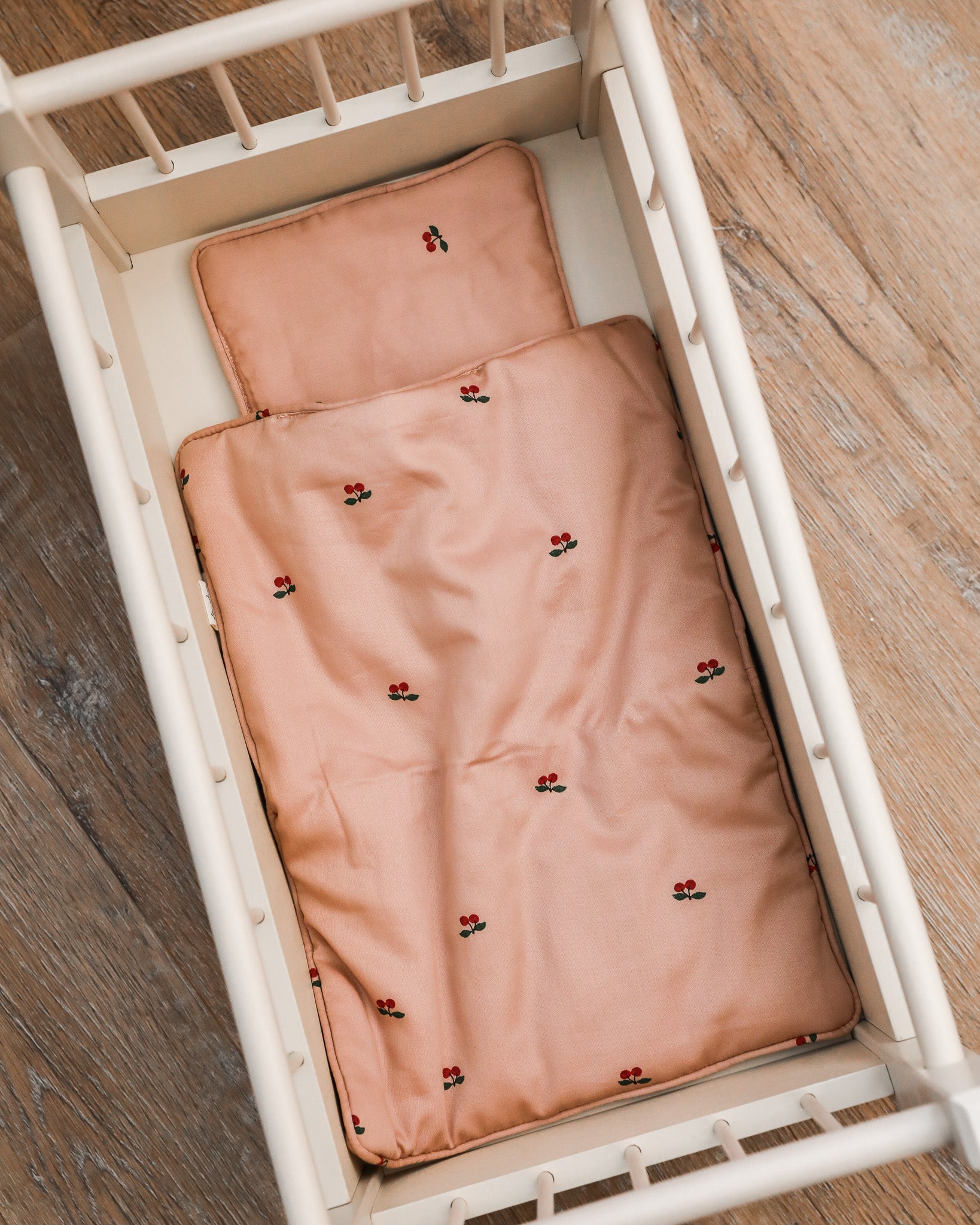 Luxurious doll bedding set with color-coordinated pillow and blanket for imaginative play