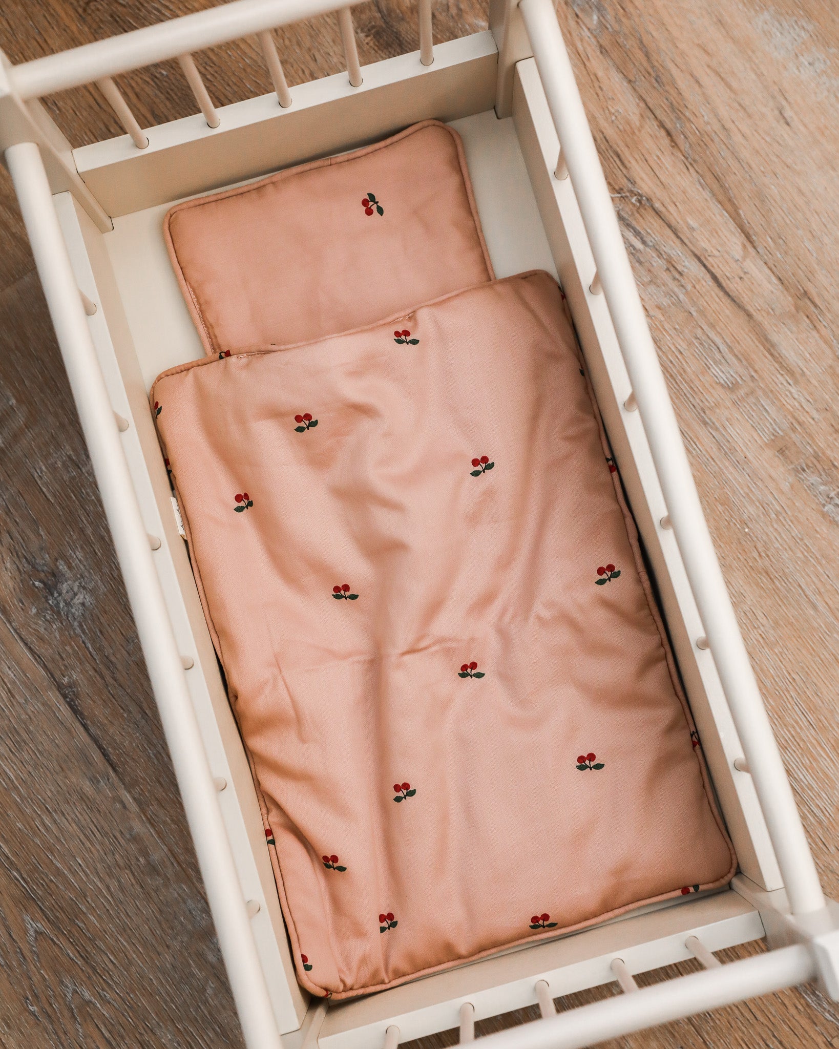 Luxurious doll bedding set with color-coordinated pillow and blanket for imaginative play