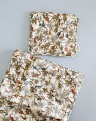 Miniature doll pillow and blanket promoting nurturing pretend play