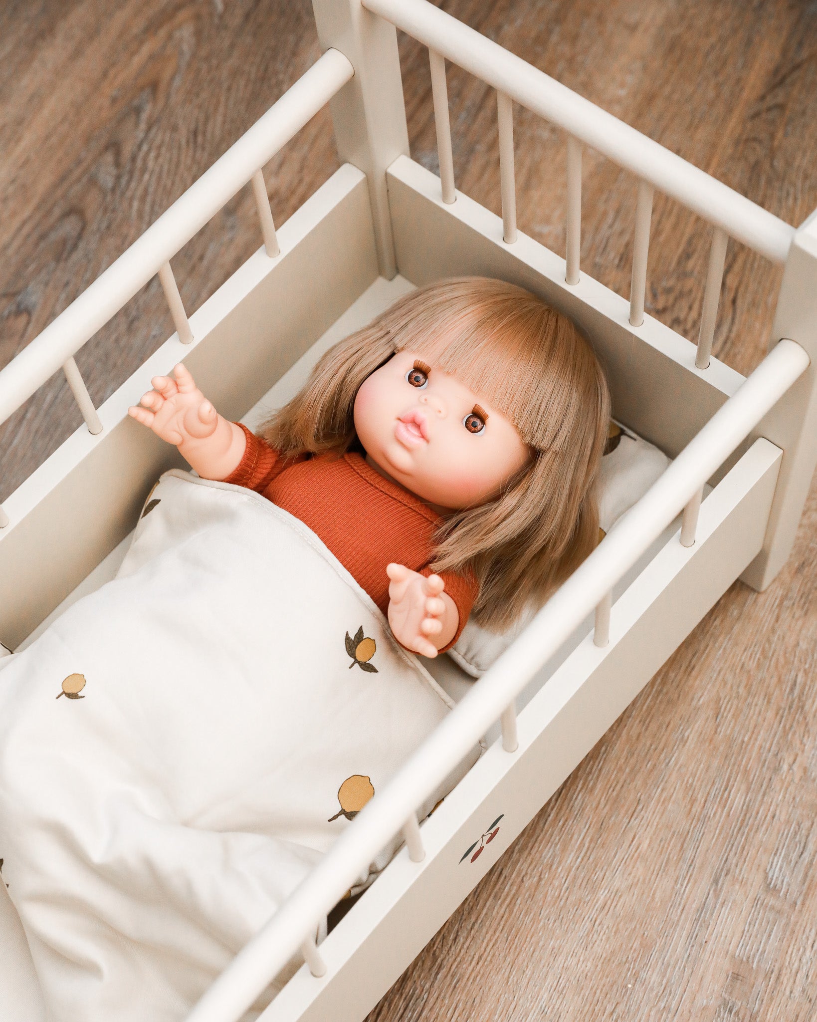 Doll accessories featuring seasonal bedding set for year-round pretend play