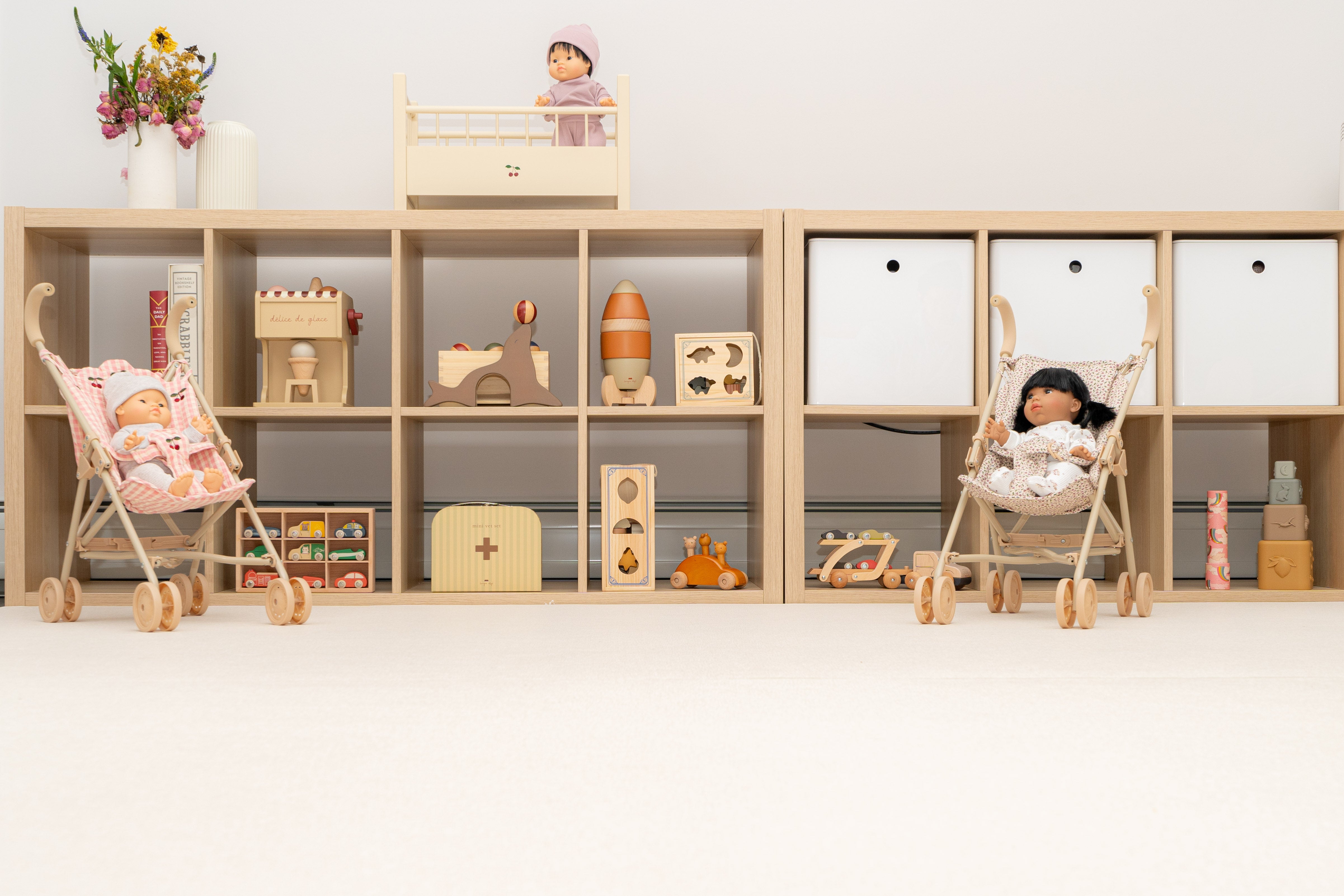 Child playing with toys and doll accessories to spark imagination