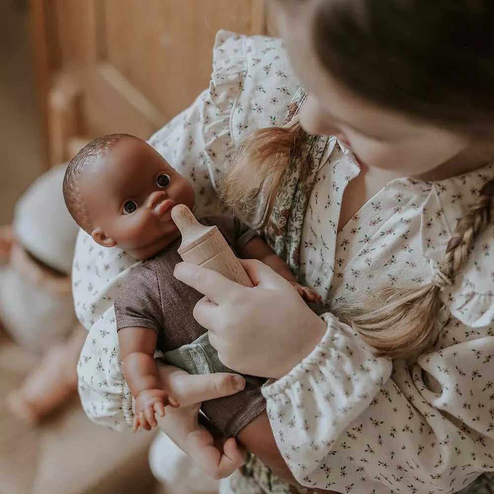 Minikane doll with vanilla-scented vinyl construction and realistic features for children 3 years and older