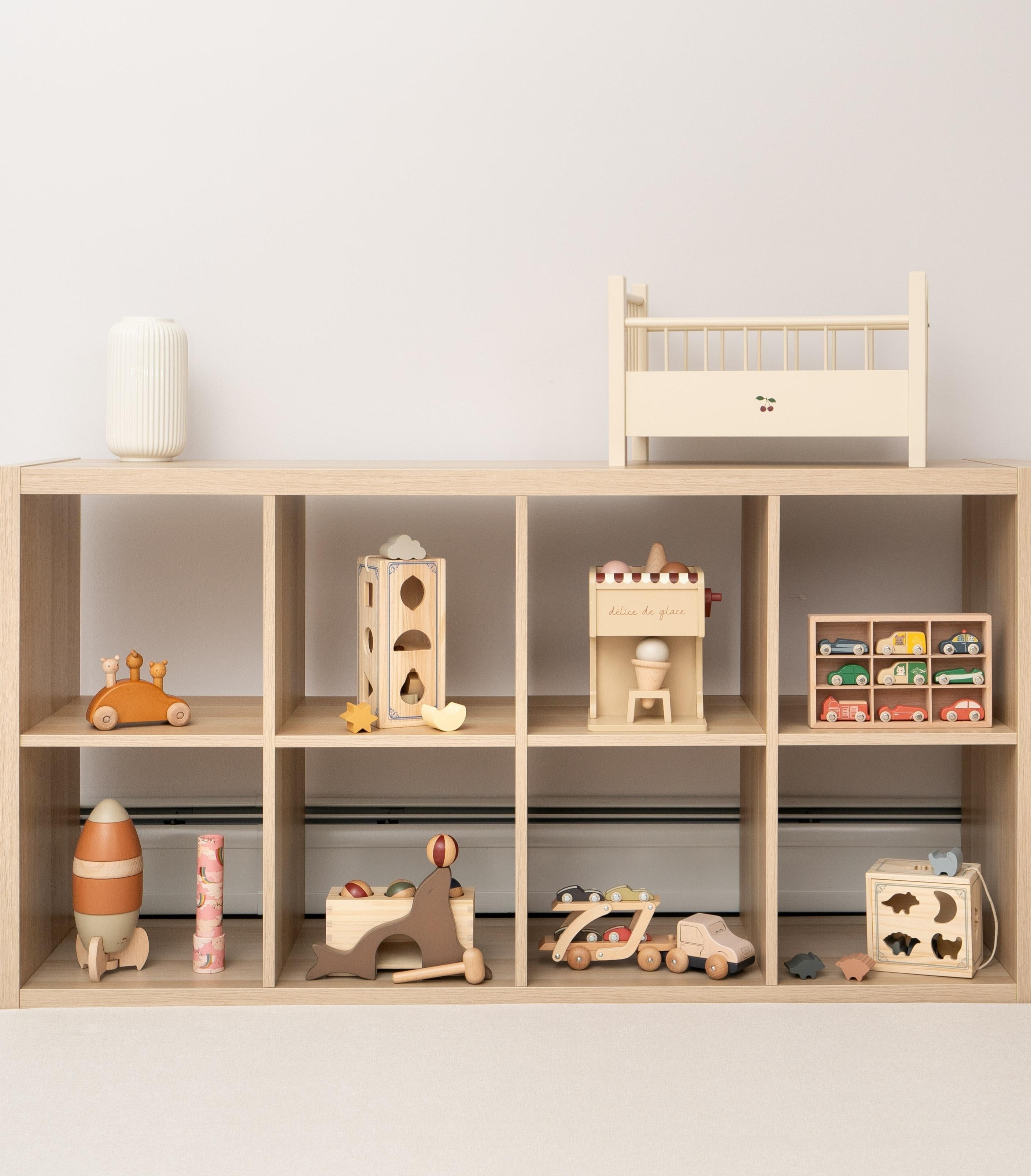 Safe wooden toys arranged in modern playroom showing quality craftsmanship and child-friendly design