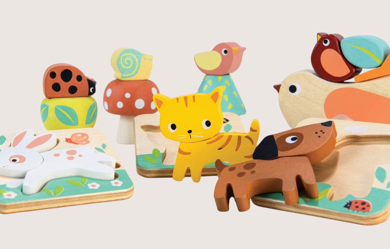Set of colorful wooden animal toys on a light background