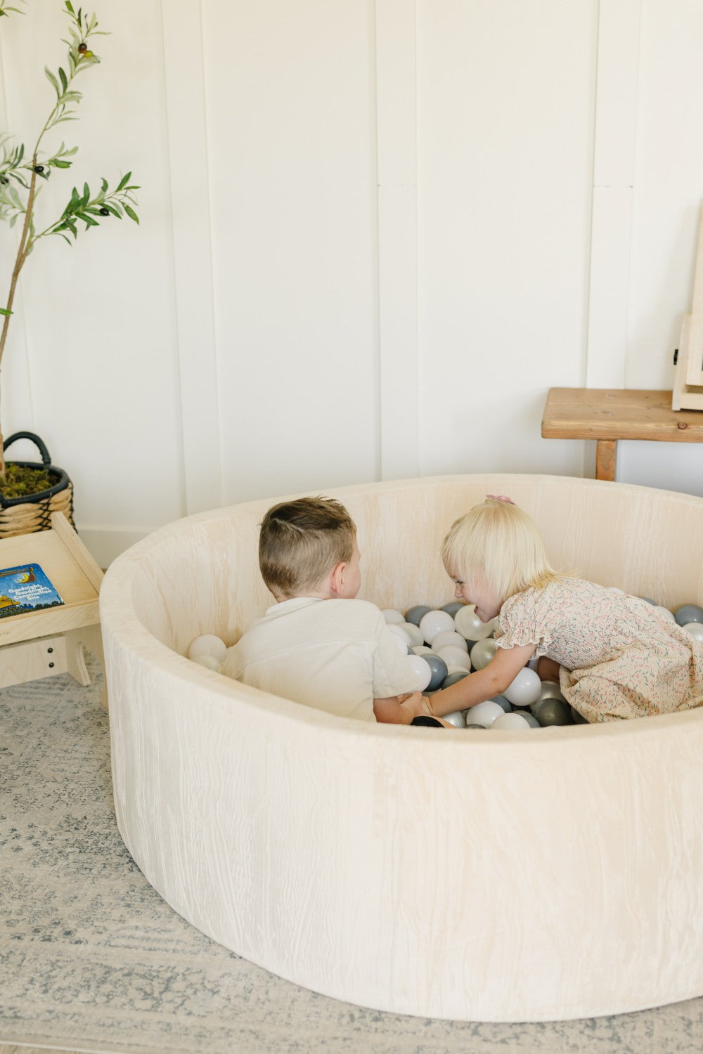 2 Children Laughing in Ball Pit