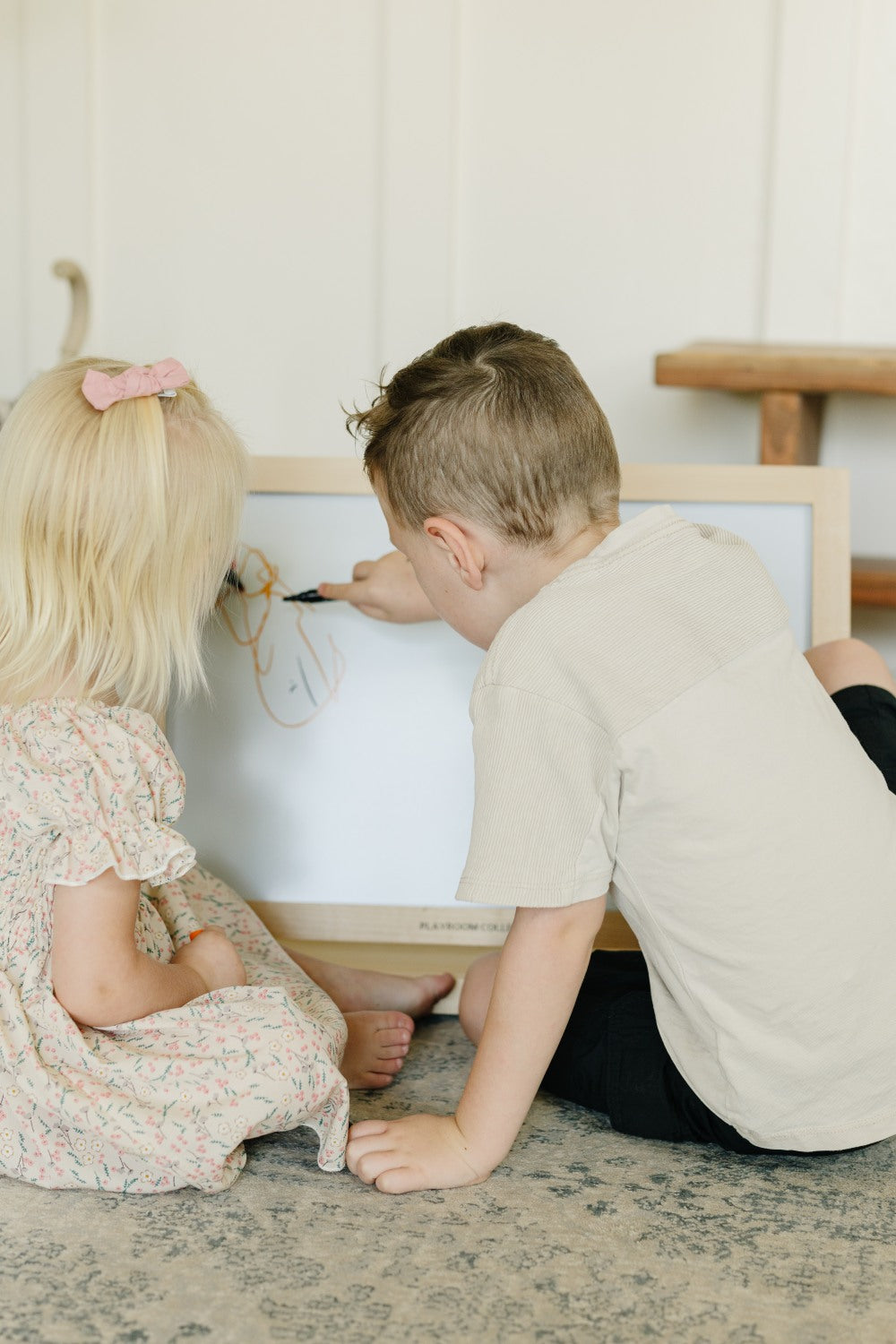 2 Children on Tabletop Easel